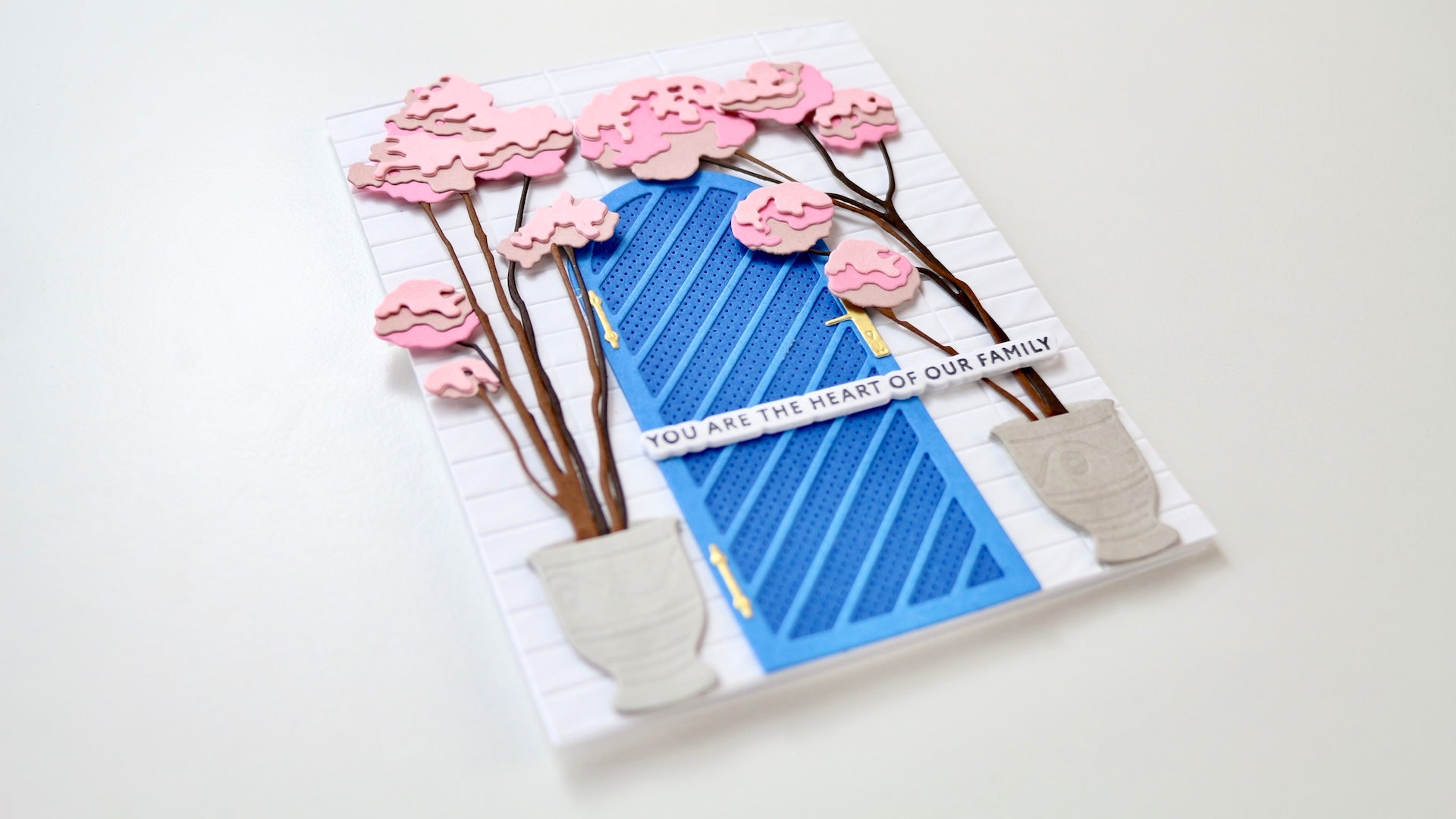 The featured photo shows the finished card made with the Arched Doors Layering die set.