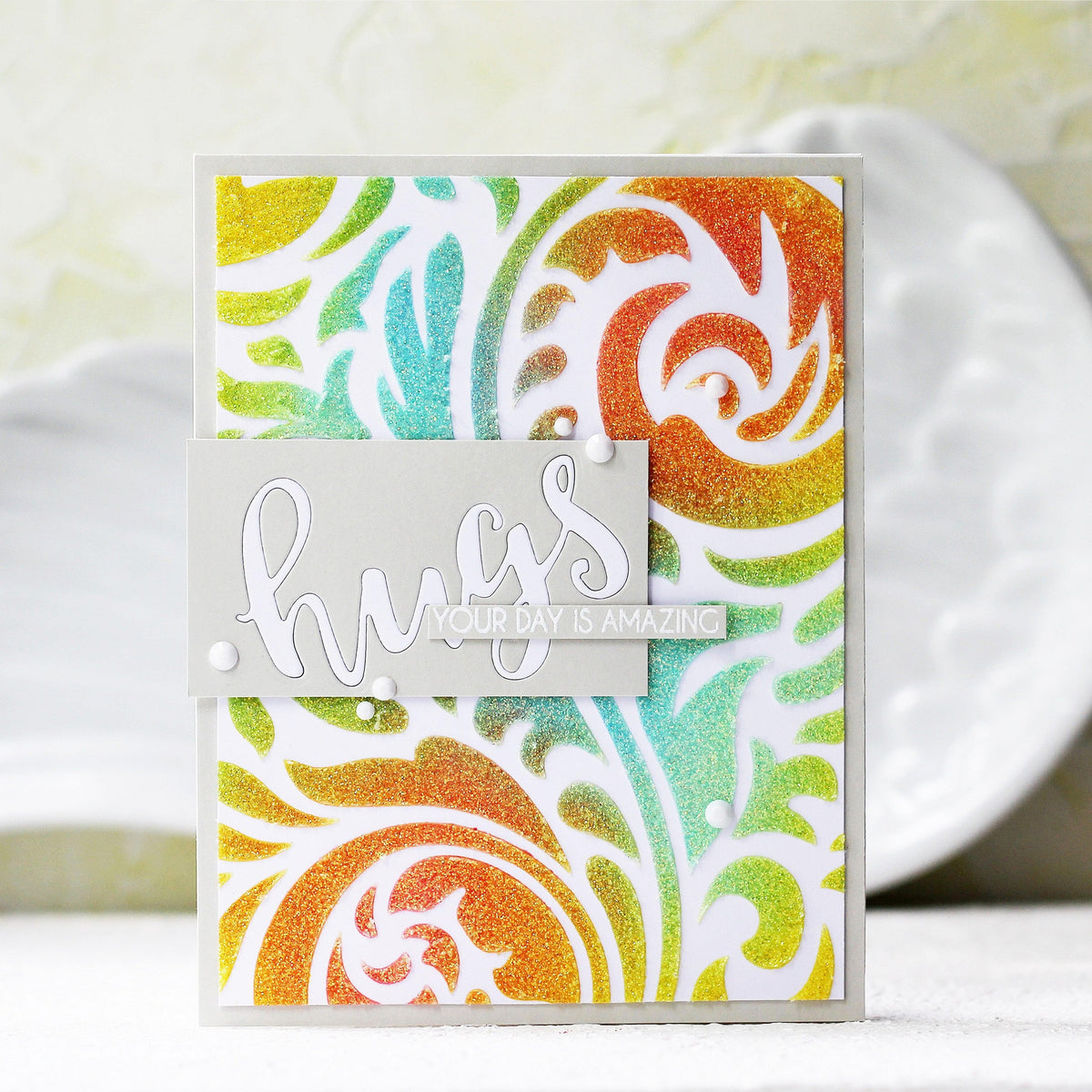 On Demand Altenew class showing techniques for adding interest to stamped images using stencils, with example stamped and stenciled designs.