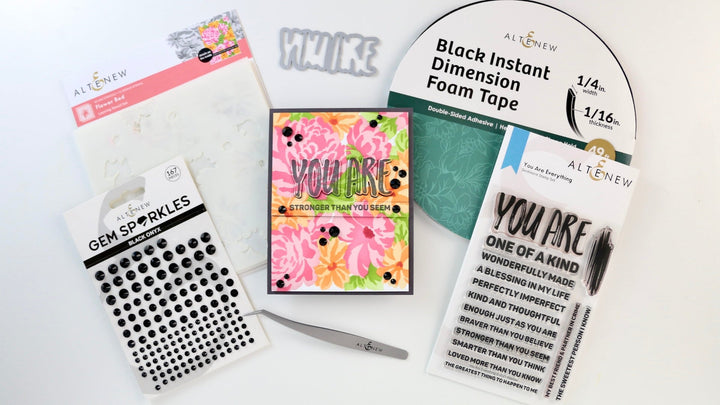 The featured photo shows the final card made with the Flower Bed Layering Stencils 
