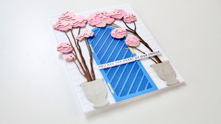 The featured photo shows the finished card made with the Arched Doors Layering die set. 