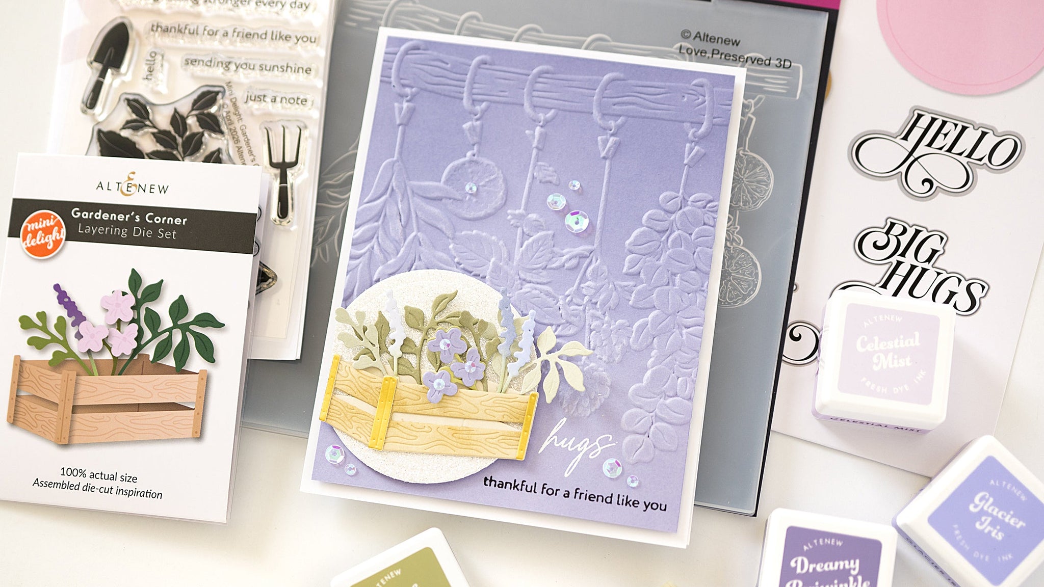 Pastel garden‑themed handmade card with embossed texture, die‑cut leaves, flowers, and stamped sentiments.