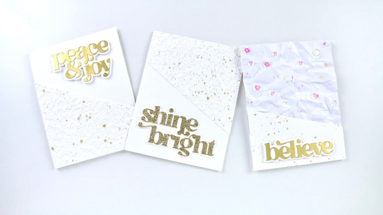 The photo shows the three holiday cards featured in today's blog post. 