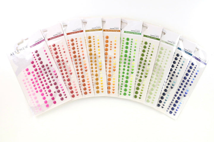 The photo shows a selection of enamel dots. 