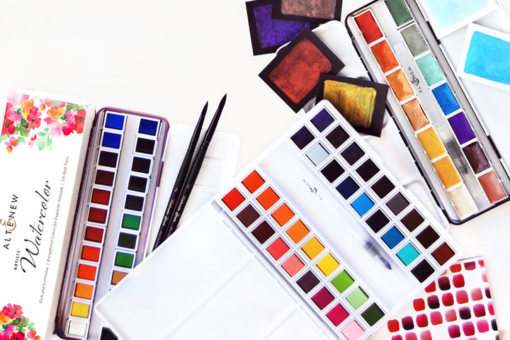 Different Altenew watercolor pan sets and their swatches