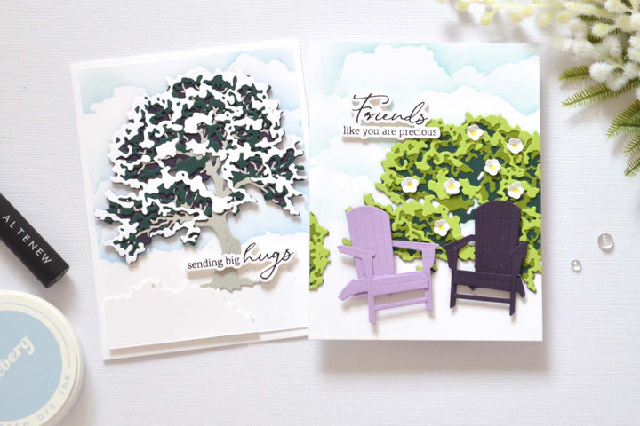 Two cards made with the same maple tree layering die set showing winter and summer scenes by Therese Calvird