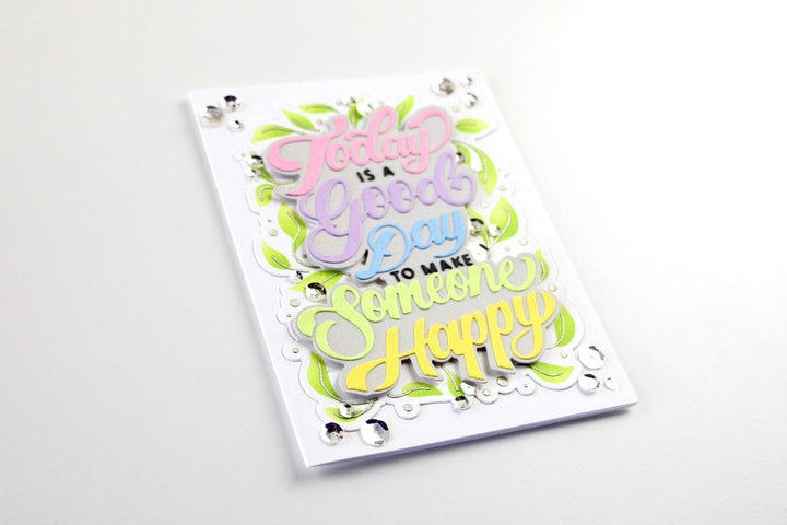 The photo shows a card made with the Today Is A Good Day layering stencils and diecut set. 