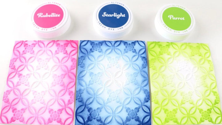 The photo shows three different backgrounds, made with embossing folders and ink blending 