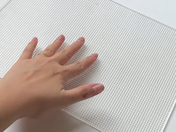 Place your sticky mat on a flat surface