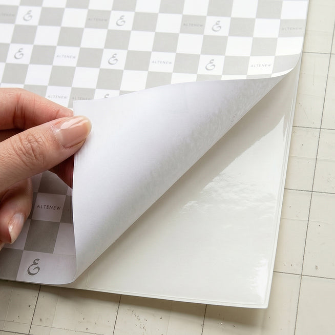 Altenew double-sided adhesive sheets, 8.5 x 11 inches, 10 sheets in a set, ideal for crafting and scrapbooking projects.