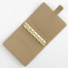 Beige Altenew Swatch Book Album A7 with tabbed pages, compact tools for organizing and storing color swatches.