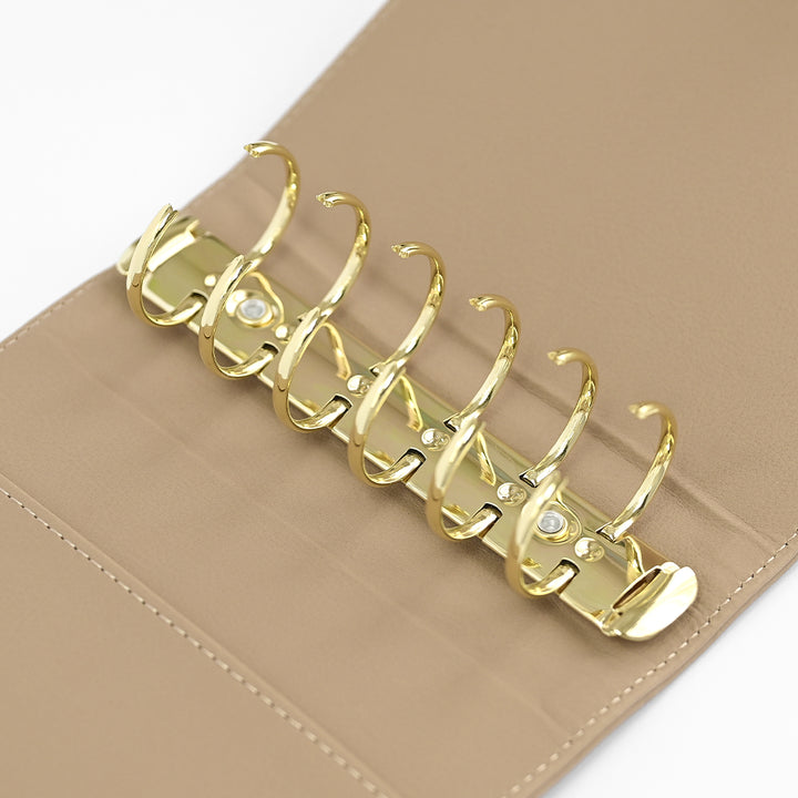 Beige Altenew Swatch Book Album A7 with tools for organizing and storing swatches, compact and stylish for craft projects.