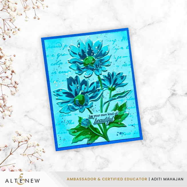 Silver pigment ink stamped image of a daisy stencil from Altenew's Paper Echoes collection, created by Aditi Mahajan.