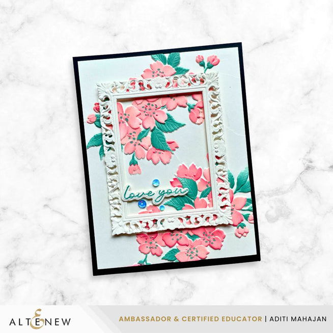 Altenew Sakura Blossoms stamp, stencil, and embossing folder bundle with delicate cherry blossom designs on a craft sheet.