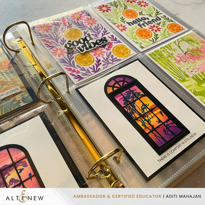 Altenew ivory complete bundle with pocket pages, featuring a three-ring photo album decorated with floral designs and Aditi Mahajan art.