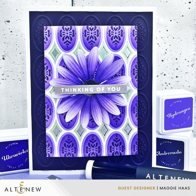 Altenew Heirloom Filigree stencil and embossing folder with intricate floral design on a crafting background