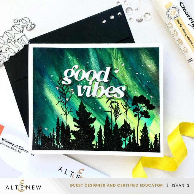 Altenew Woodland Silhouette Clear Stamp Set with warm cozy sentiments, dies, glue, and iridescent sequins for crafting.