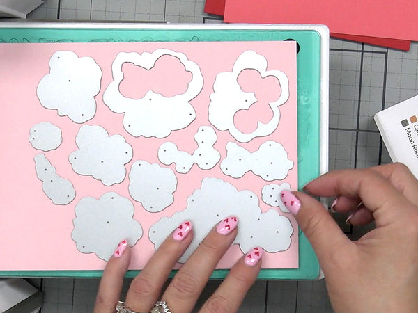 Place your cardstock and die into your die-cutting machine.