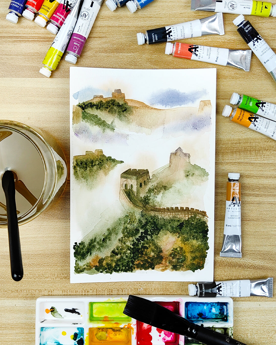 Watercolor painting of the Great Wall surrounded by Artistry by Altenew watercolor tubes