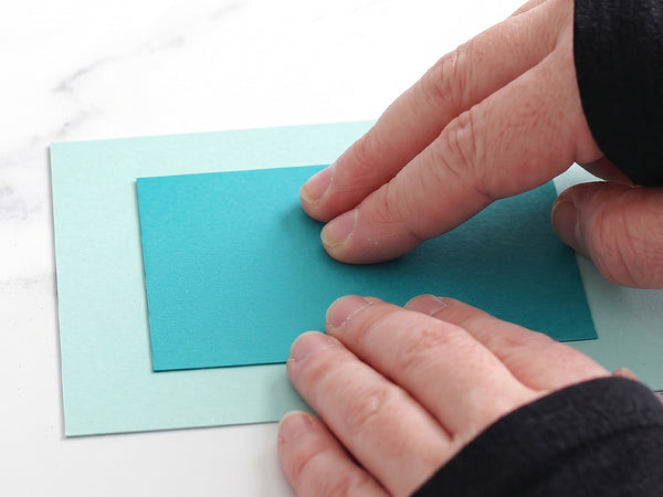Place your cardstock or die-cut into place and press down gently for an instant, permanent hold with zero drying time!