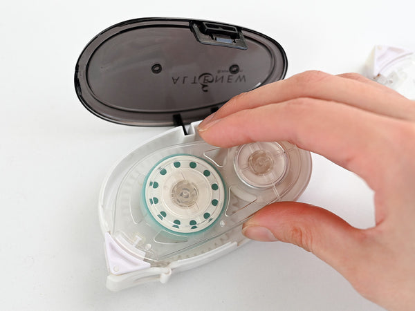 To refill, pop open the compact casing and drop in a fresh adhesive cartridge.