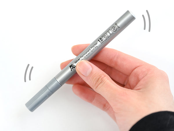 With the cap securely on, shake the marker to thoroughly mix the ink inside.