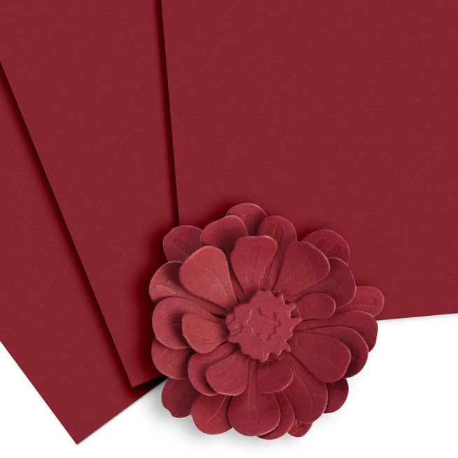 Altenew Crafty Necessities Cardstock Bundle with colorful sheets in various shades and textures for crafting projects.