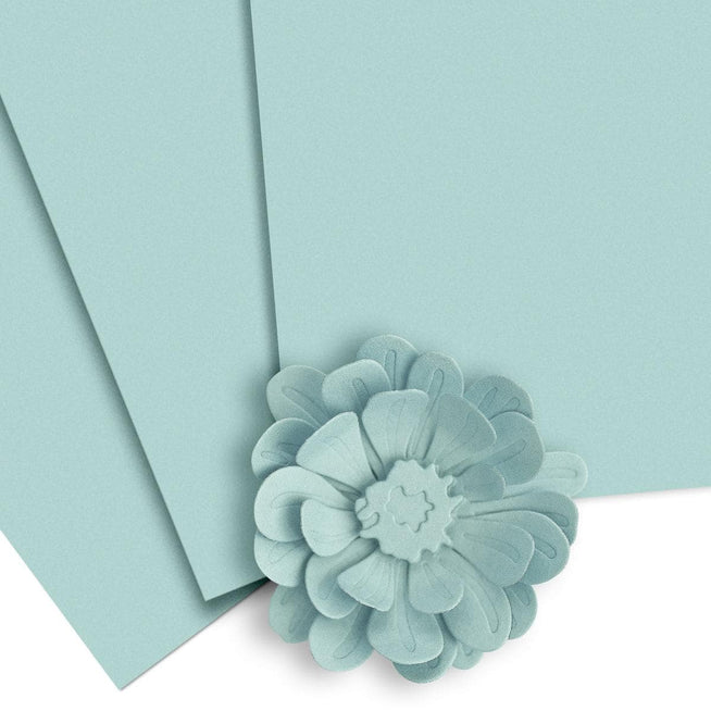 Altenew Crafty Necessities cardstock bundle with colorful sheets of thick paper for crafting and card making projects.