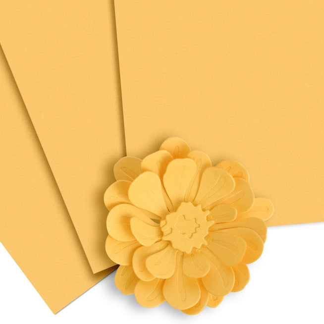 Ten sheets of Altenew Crafty Necessities Warm Sunshine Cardstock, vibrant yellow paper for crafting and card making.