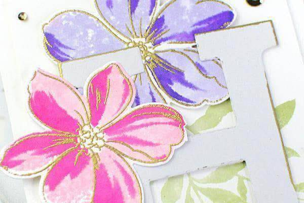 Altenew on-demand cardmaking class featuring exploring watercolor mediums with example cards and watercolor tools on a table.