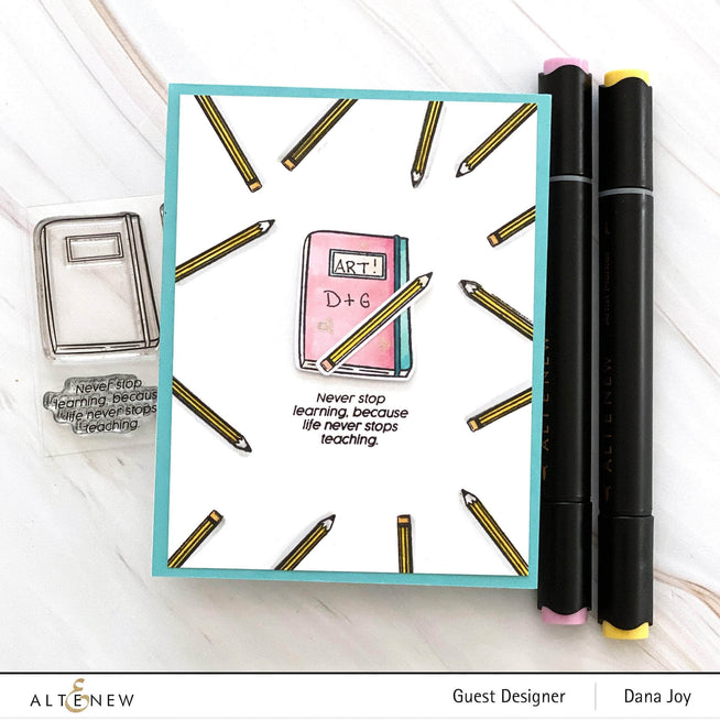Altenew Handy Dandy Notebook Clear Stamp Set featuring various notebook and writing-themed stamps on transparent sheets.