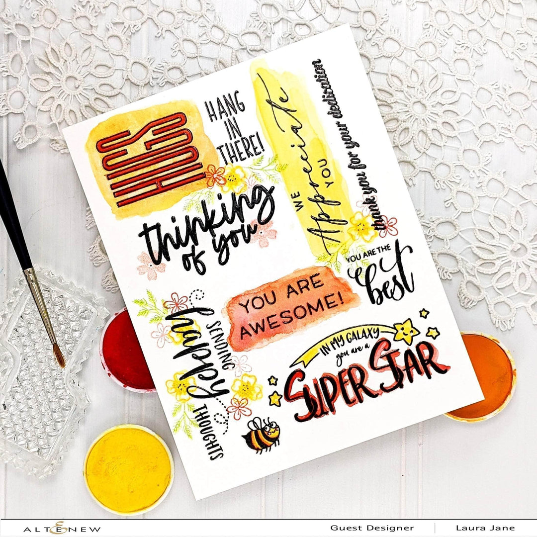 Set of Altenew Thinking of You clear stamps with floral and script designs for card making and crafting projects.