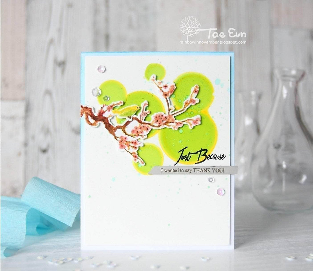 Altenew Under the Cherry Blossom Tree clear stamp set with cherry blossom and tree designs on transparent rubber for crafting.