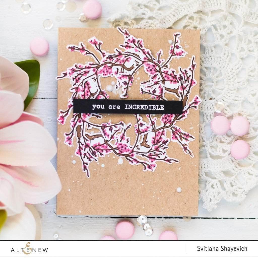 Altenew Under the Cherry Blossom Tree clear stamp set with cherry blossom designs on transparent stamps.