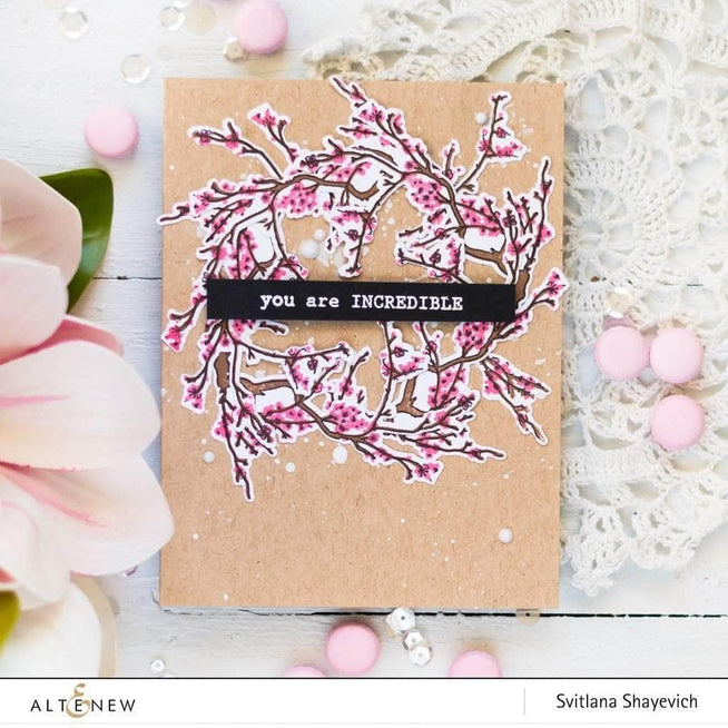 Altenew Under the Cherry Blossom Tree clear stamp set with cherry blossom designs on transparent stamps.