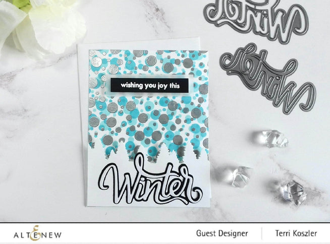 Altenew Hello Winter Die Set featuring festive winter-themed metal dies for paper crafting and holiday card making.
