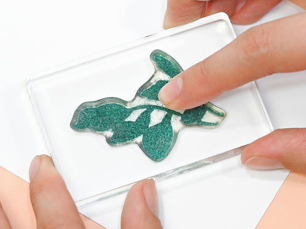 Lift the stamp straight up to prevent smudging.