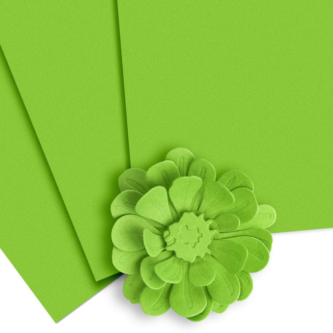 Altenew Crafty Necessities Cardstock Bundle with colorful sheets laid out, showcasing vibrant paper for crafting projects.