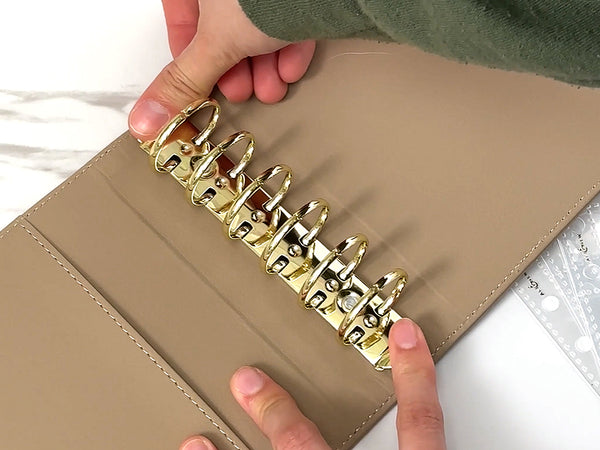 Open the album rings and insert your A7 pocket pages.
