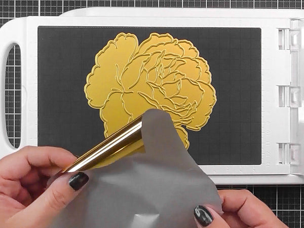 Create a sandwich with your cardstock and foil of choice pretty side up.