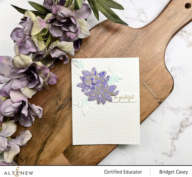 Altenew Gardens Around the World Mini Stamp Bundle with various botanical and garden-themed rubber stamps for crafting.