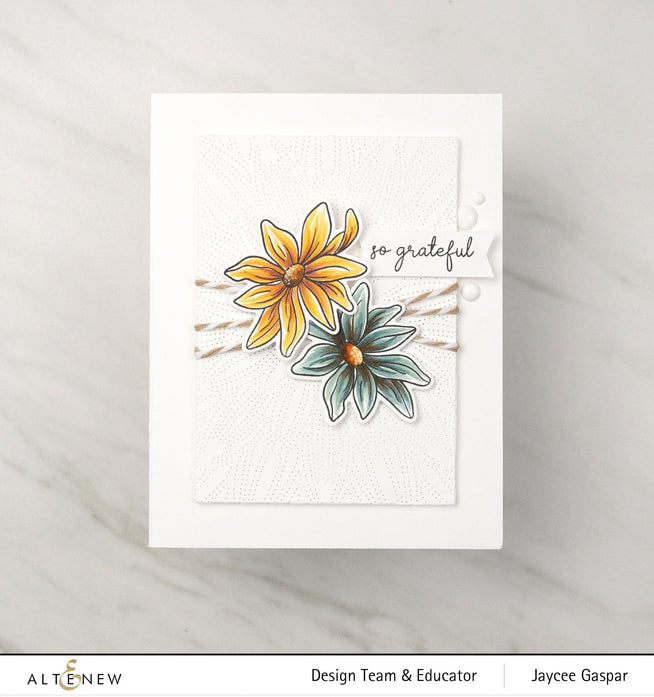 Altenew Gardens Around the World Mini Stamp Bundle with diverse floral and garden-themed rubber stamps for crafting projects.