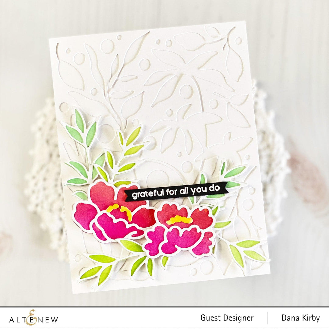 Altenew Happy Blossoms Ensemble stamp and die bundle featuring floral and butterfly designs on clear stamps and metal dies.