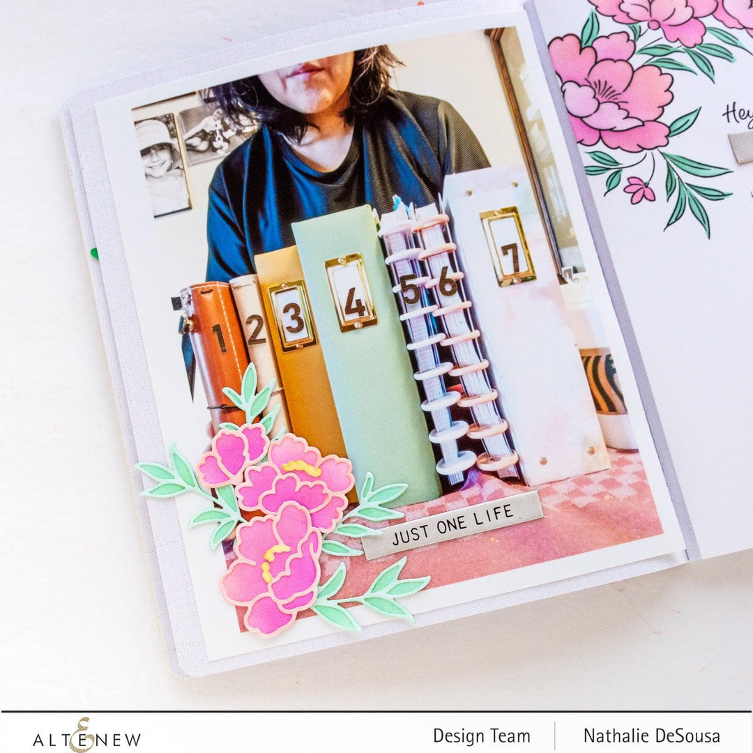 Altenew Happy Blossoms Ensemble stamp and die bundle with floral designs, featuring colorful stamped flowers and matching metal dies.