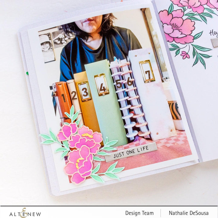 Altenew Happy Blossoms Ensemble stamp and die bundle with floral designs, featuring colorful stamped flowers and matching metal dies.