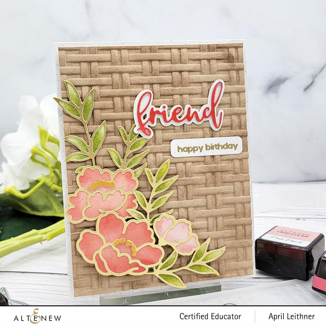 Altenew Happy Blossoms Ensemble stamp and die bundle with floral designs on clear stamps and metal dies for crafting.