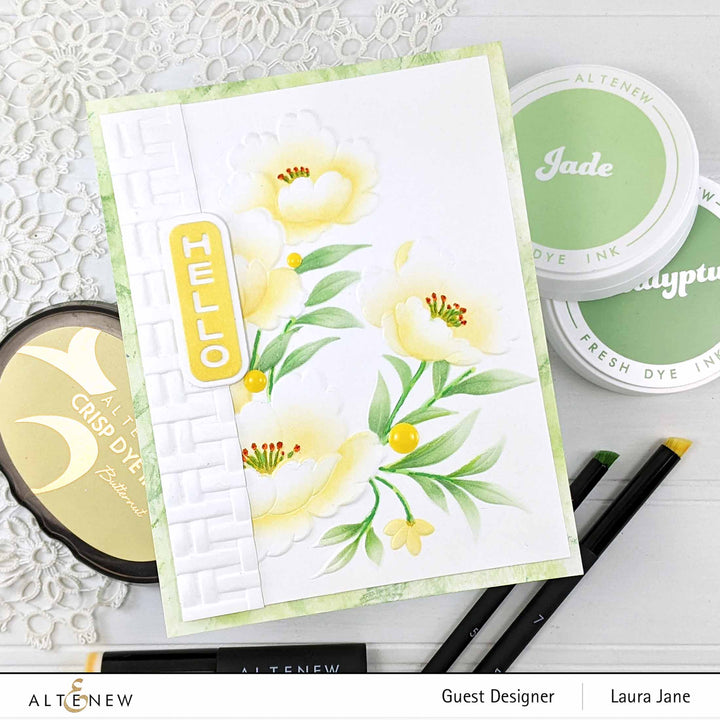 Altenew Happy Blossoms Ensemble stamp and die bundle with floral designs and coordinating dies for card making and crafts.