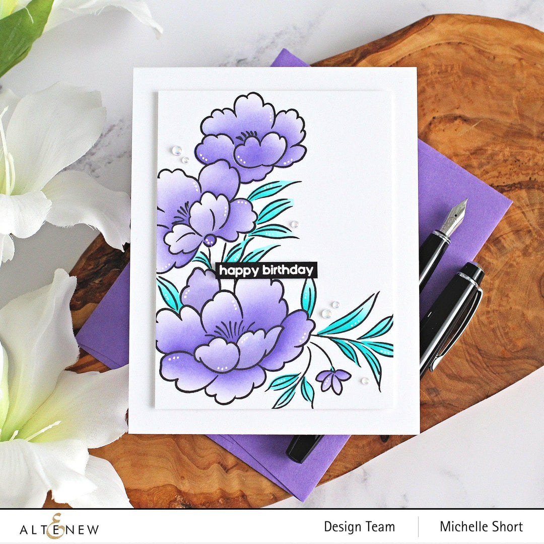 Altenew Happy Blossoms Ensemble stamp and die bundle featuring floral designs for card making and crafting projects.