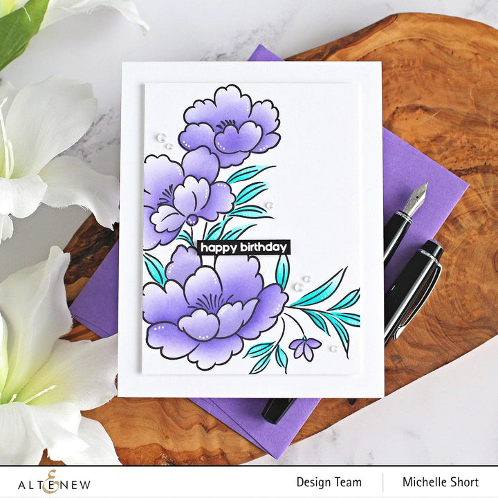 Altenew Happy Blossoms Ensemble stamp and die bundle featuring floral designs for card making and crafting projects.