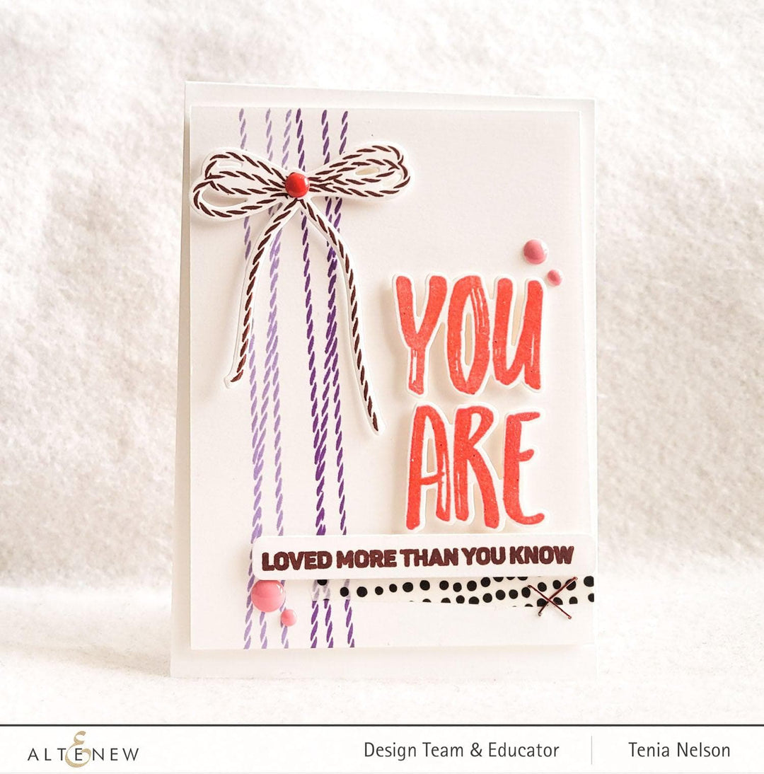 Altenew Tied With Love stamp and die bundle featuring floral and heart designs for crafting and card making.