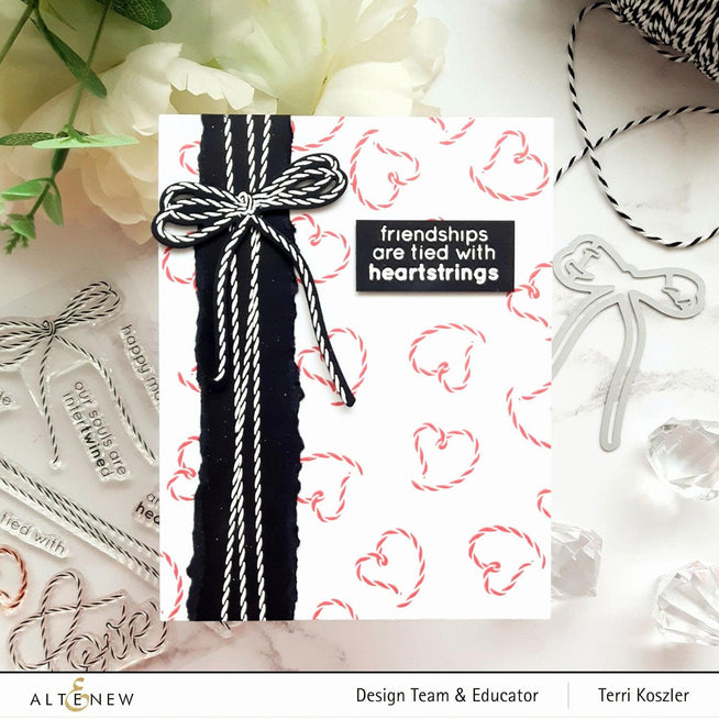 Altenew Tied With Love stamp and die bundle featuring floral and heart designs on a white background.